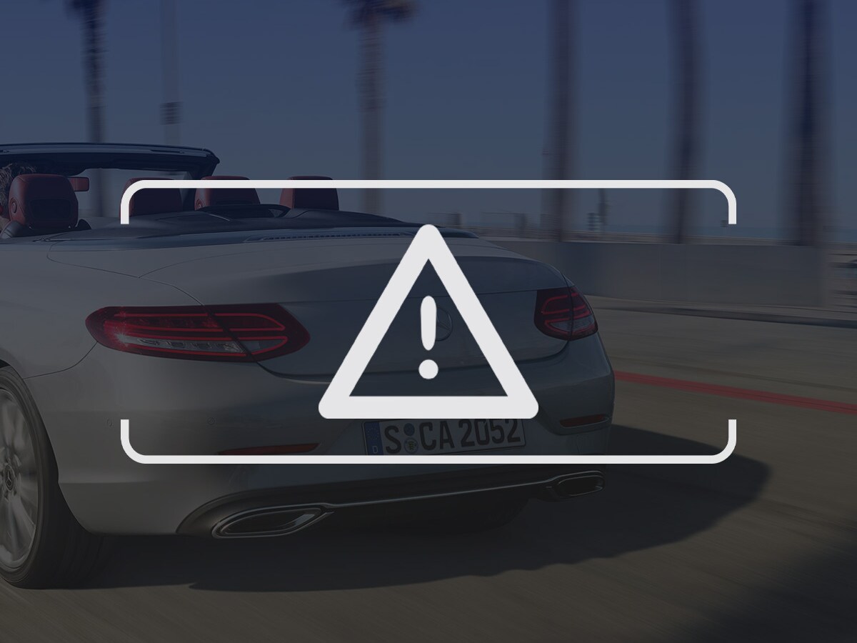 Hvidt ikon af advarselstrekant med udråbstegn