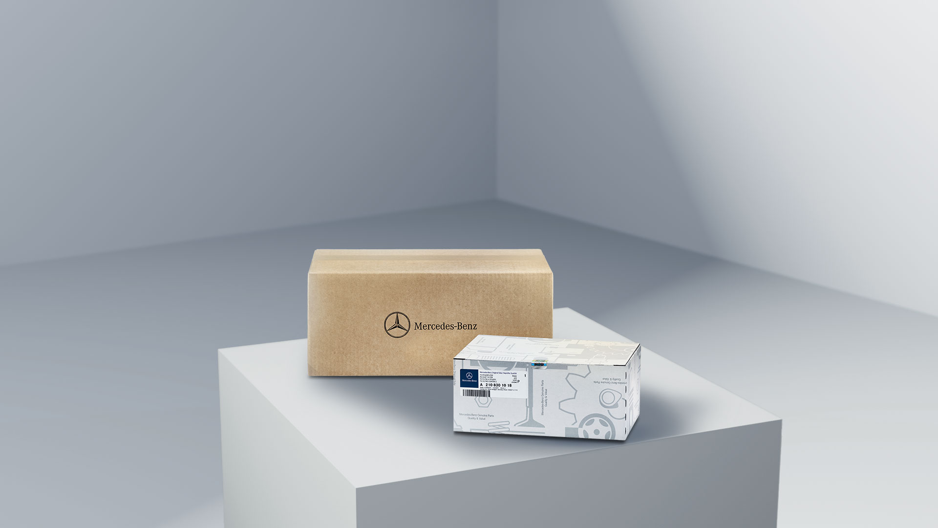 Mercedes-Benz | Varebiler kvalitetsoversigt To pakker med Mercedes-Benz logo, der symboliserer Mercedes-Benz originaldele.