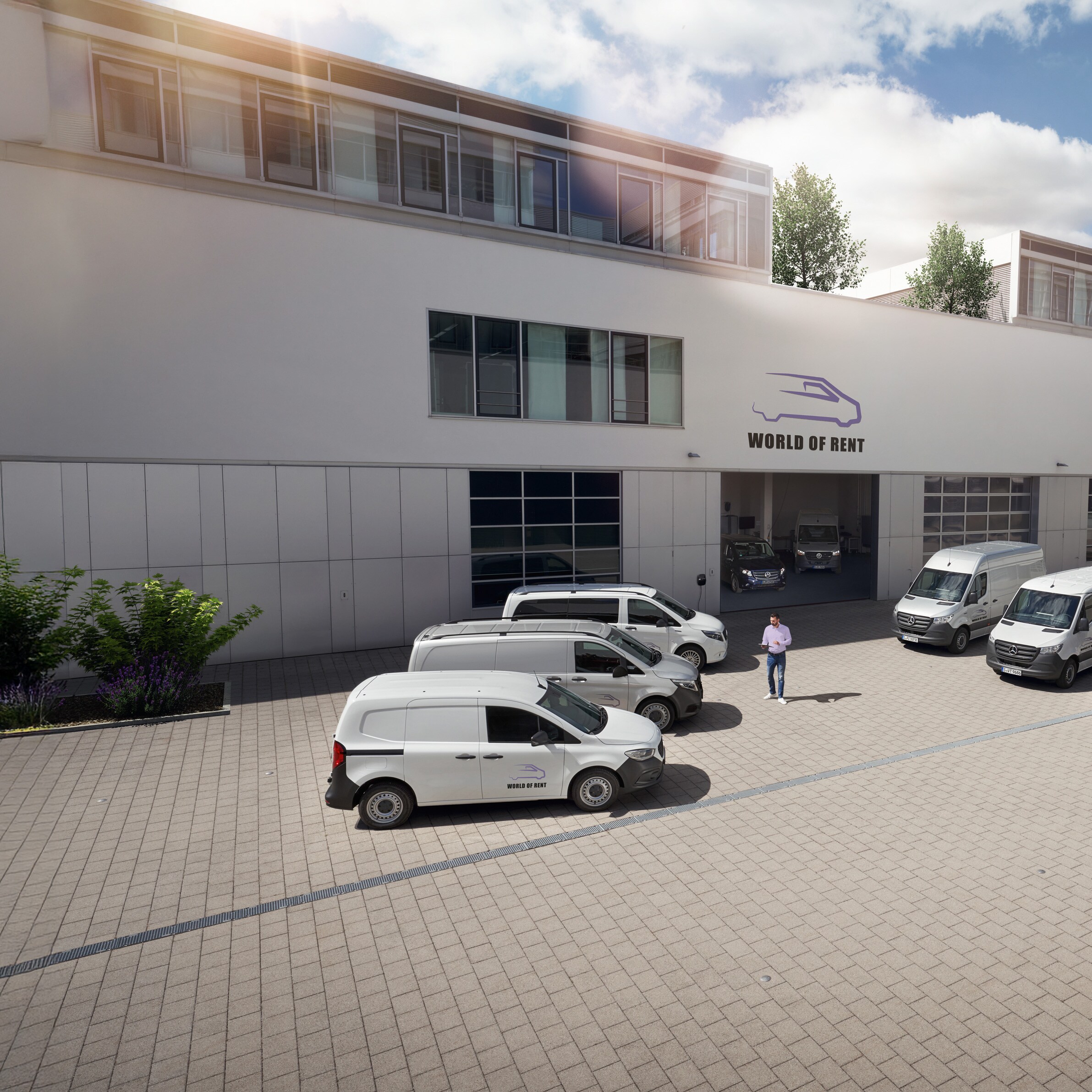 En flåde af Mercedes-Benz køretøjer foran en virksomhedsejendom.